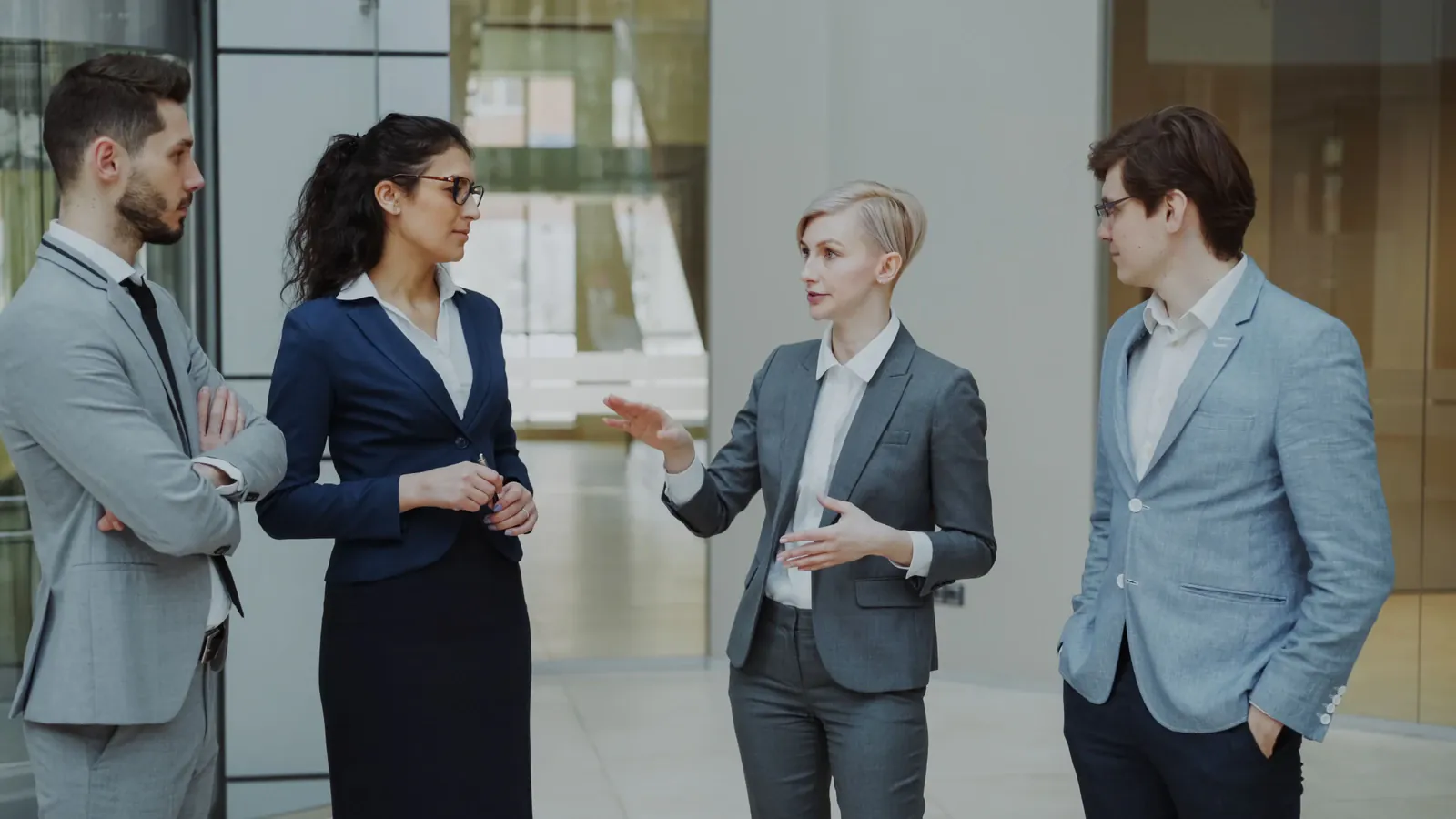 Four digital specialists discussing a website project